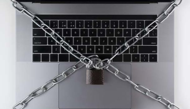 flat lay laptop with a lock chain