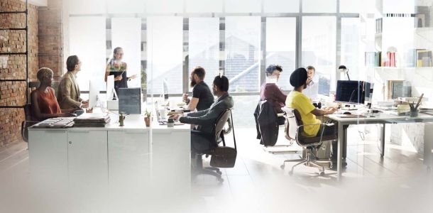 A diverse group of professionals collaborating in a modern office environment. 