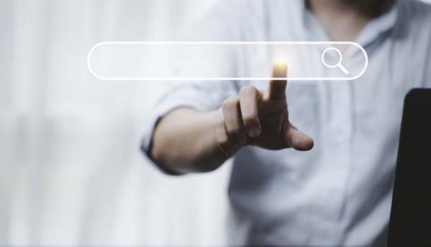 Hand touching search bar illustrating the process of a search engine